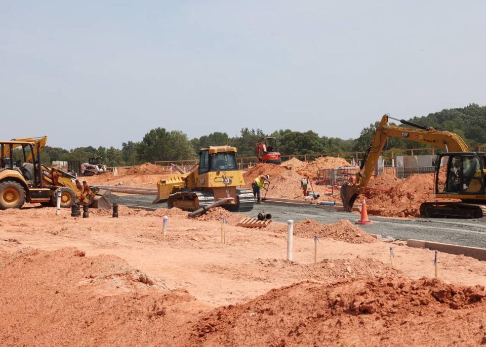 In this file photo, a construction crew works on the The Lodges at Indian Land on Fort Mill Highway. Lancaster County had the biggest growth in total population and in its Hispanic population.