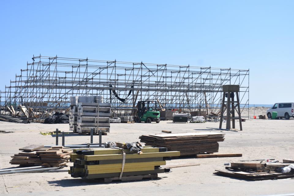 Workers tear down stages, bleachers and tents on Tuesday, October 3, 2023, after a successful inaugural Oceans Calling Festival on the Boardwalk in Ocean City, Maryland.