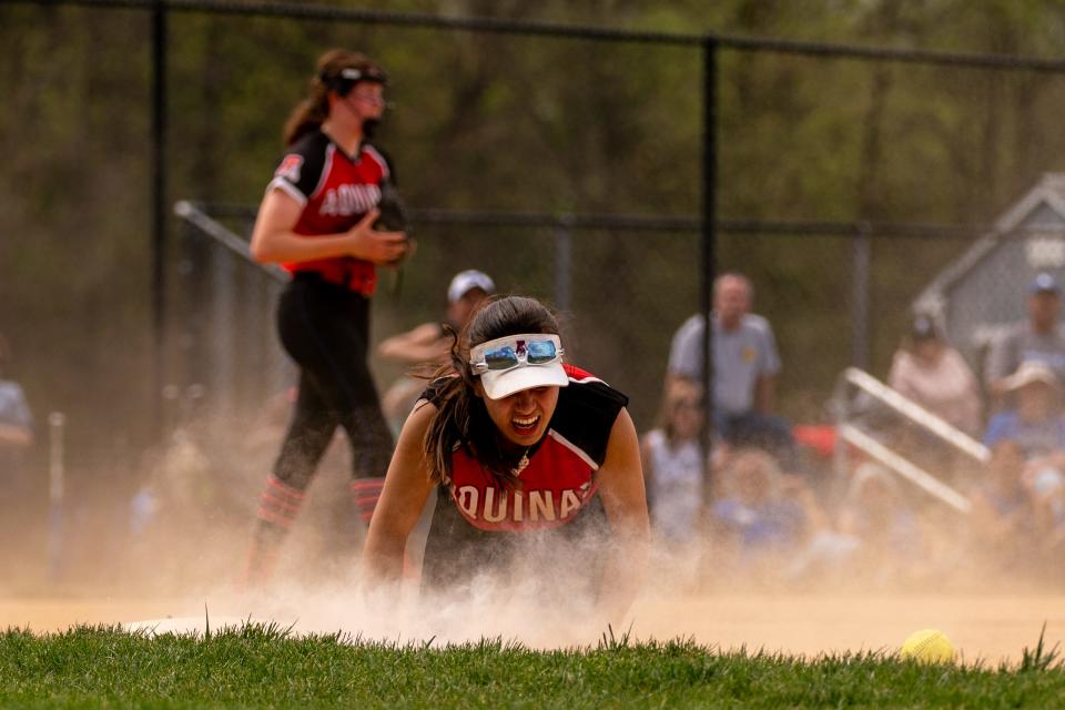 St. Thomas Aquinas' Kamerin Collado (23) tries to catch the ball in a game against Metuchen on Saturday, April 15 afternoon at the field at Metuchen High School.