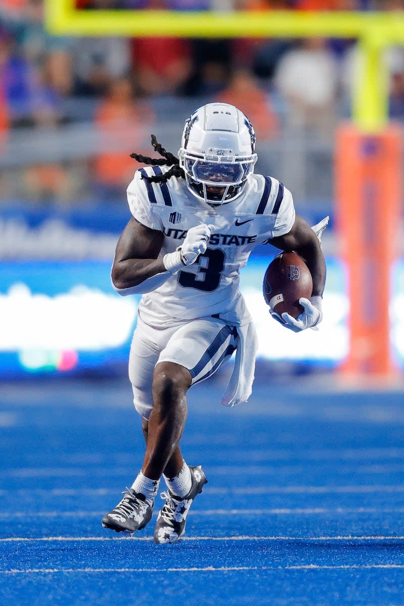 Utah State running back Rahsul Faison (3) runs with the ball against Boise State in the second half of an NCAA college football game, Saturday, Oct. 5, 2024, in Boise, Idaho. Boise State won 62-30. (AP Photo/Steve Conner) | Steve Conner