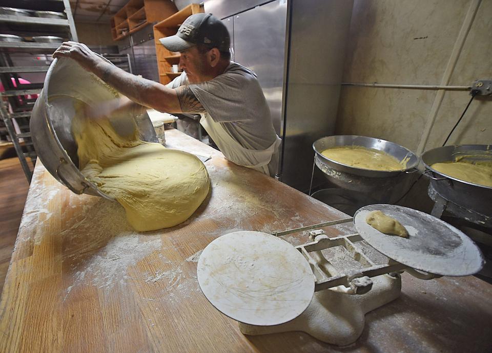 Owner John Arruda works with the sweet bread dough at Lou's Bakery on East Main Street in Fall River on Thursday, March 21, 2024.