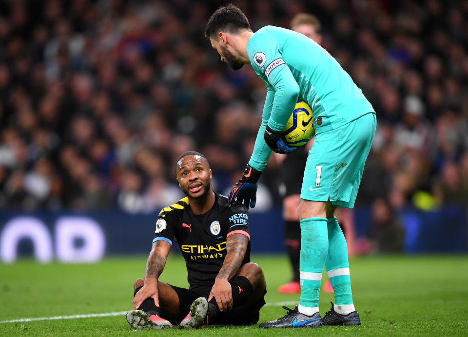 LONDON, ENGLAND - FEBRUARY 02: Hugo Lloris of Tottenham Hotspur consoles Raheem Sterling of Manchester City who reacts before going off injured during the Premier League match between Tottenham Hotspur and Manchester City at Tottenham Hotspur Stadium on February 02, 2020 in London, United Kingdom. (Photo by Laurence Griffiths/Getty Images)