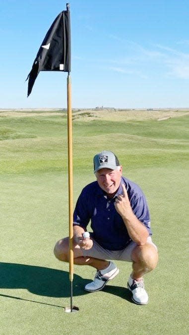 Mike Strandell of Watertown poses for a picture recently after acing the par-4, 300-yard No. 4 hole at the Sutton Bay Golf Course near Agar.