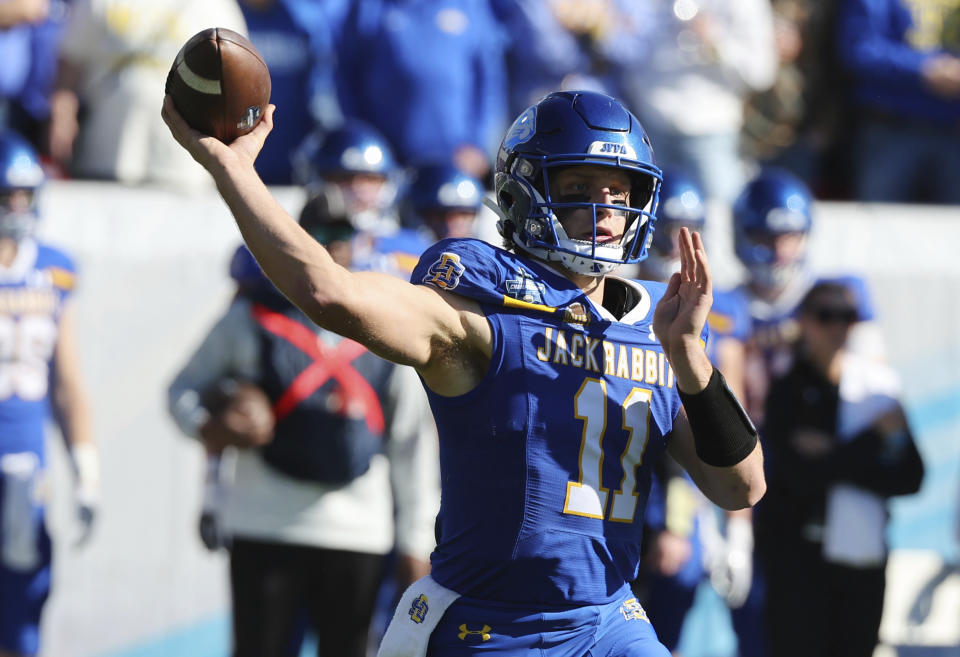 South Dakota State quarterback Mark Gronowski (11) passes the ball in the first quarter against Montana at the FCS Championship NCAA college football game Sunday, Jan. 7, 2024, in Frisco, Texas. (AP Photo/Richard W. Rodriguez)