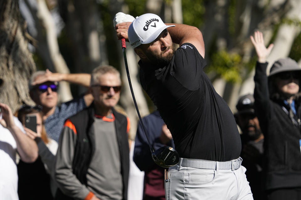 Jon Rahm hits from the sixth tee during the American Express golf tournament on the La Quinta Country Club Course Thursday, Jan. 19, 2023, in La Quinta, Calif. (AP Photo/Mark J. Terrill)