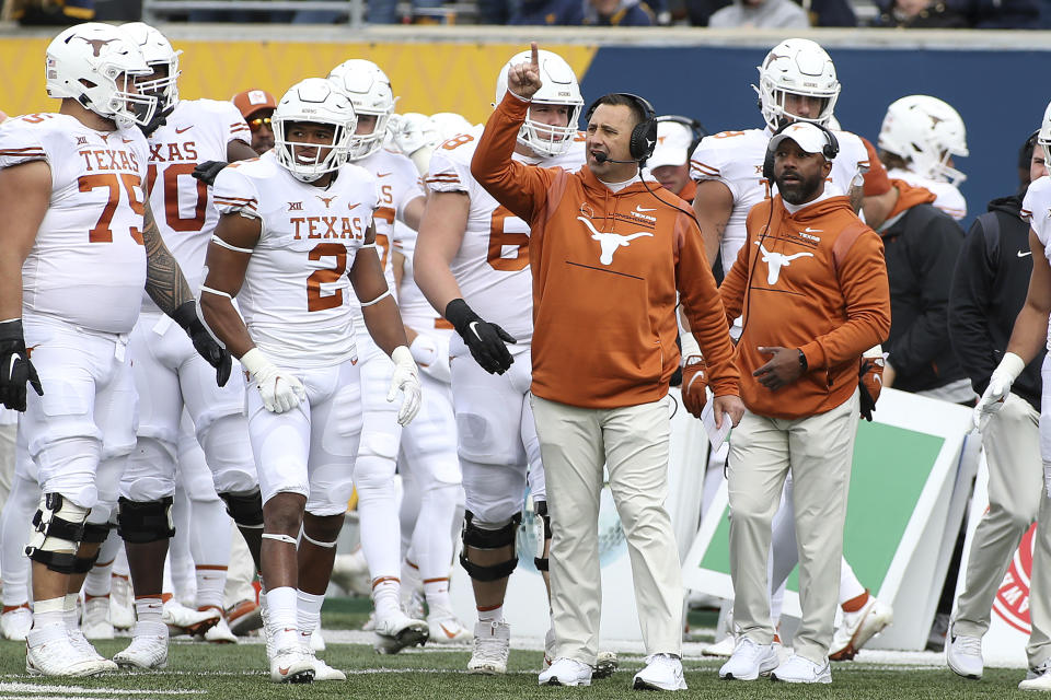 Texas coach Steve Sarkisian reacts on the sideline during the first half of an NCAA college football game against West Virginia in Morgantown, W.Va., Saturday, Nov. 20, 2021. (AP Photo/Kathleen Batten)