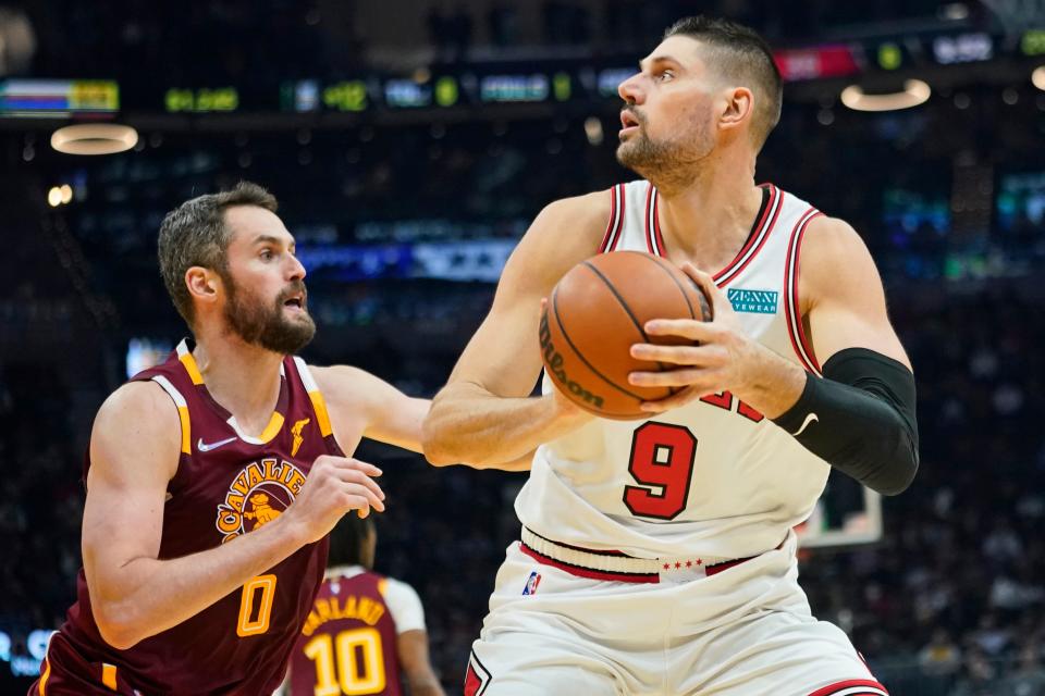 Cavaliers forward Kevin Love (0) guards the Chicago Bulls' Nikola Vucevic during a 115-92 win Wednesday night. Love said the Cavs are learning how to compete at a higher level. [Tony Dejak/Associated Press]