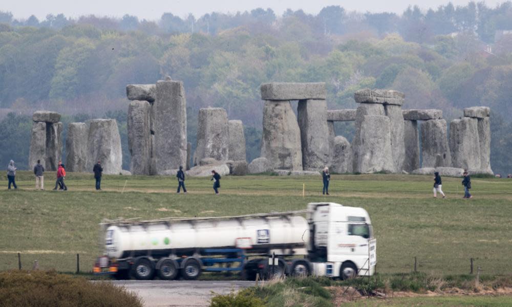 Traffic passes along the A303 next to Stonehenge