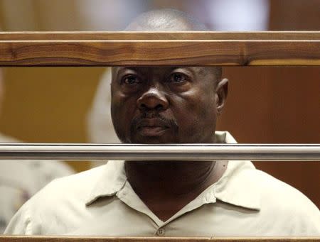 Lonnie David Franklin Jr. stands in court during his arraignment on 10 counts of murder and one count of attempted murder in Los Angeles Criminal Court, in Los Angeles, California, U.S. in this July 8, 2010 file photo. REUTERS/Al Seib/Pool/File Photo