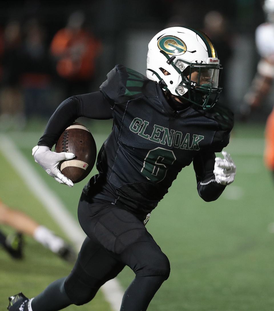 GlenOak's Avantae Burt looks for running room in a high school football game against Massillon at Bob Commings Field on Friday, August 26, 2022.