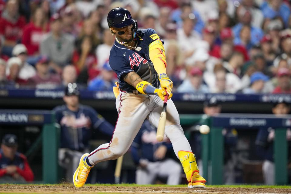 Atlanta Braves' Ronald Acuna Jr. hits a single during the fourth inning of Game 3 of a baseball NL Division Series against the Philadelphia Phillies Wednesday, Oct. 11, 2023, in Philadelphia. (AP Photo/Matt Slocum)