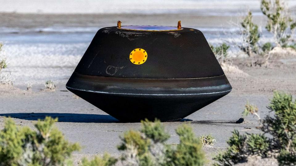 PHOTO: In this handout provided by NASA, the sample return capsule from NASA's OSIRIS-REx mission is seen shortly after touching down in the desert, on September 24, 2023 at the Department of Defense's Utah Test and Training Range in Dugway, Utah. (NASA via Getty Images)