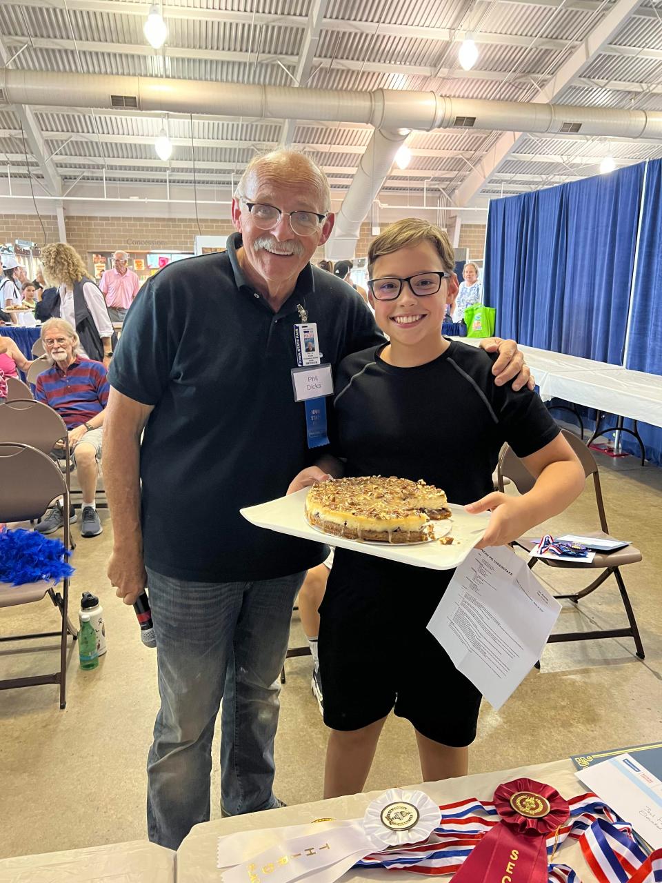 Nash Roe, right, with an award-winning delicacy at an Iowa State Fair competition.