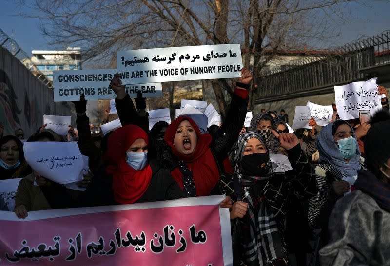 FILE PHOTO: Afghan women shout slogans during a rally to protest against what the protesters say is Taliban restrictions on women, in Kabul