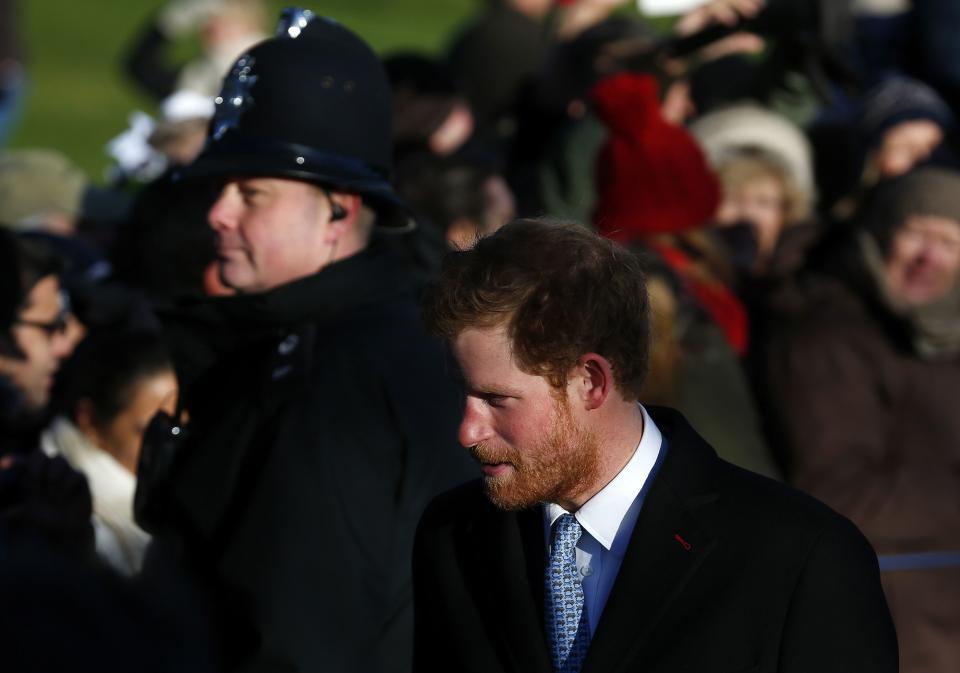 Britain's Prince Harry walks to a Christmas Day morning service at the church on the Sandringham Estate in Norfolk