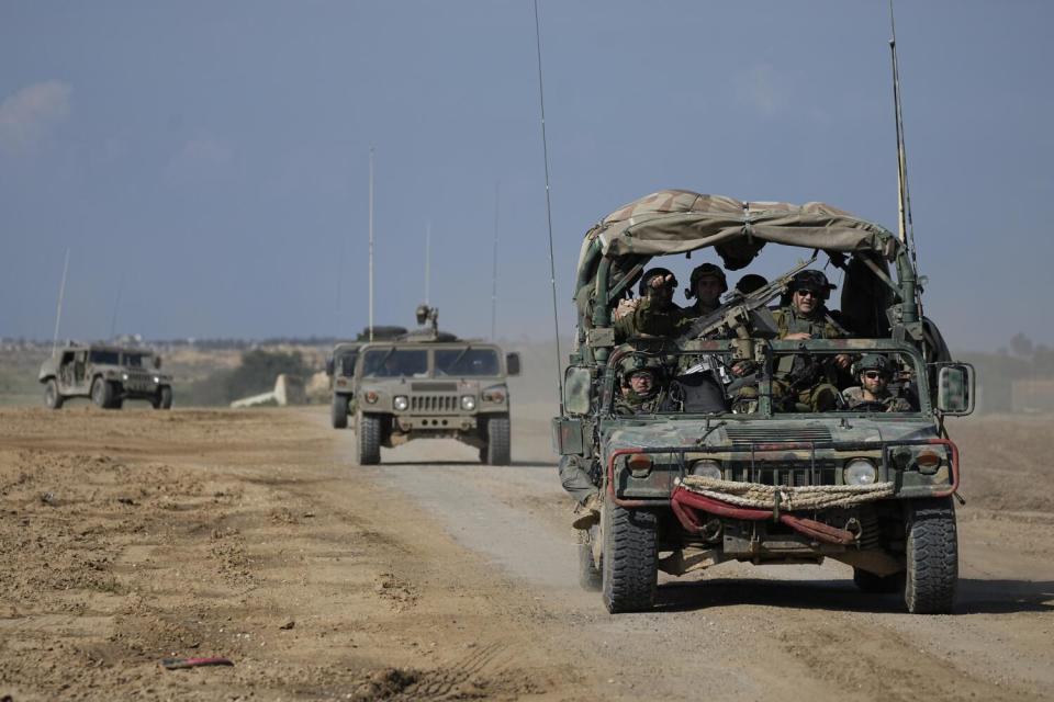 Israeli soldiers in vehicles near the border with Gaza