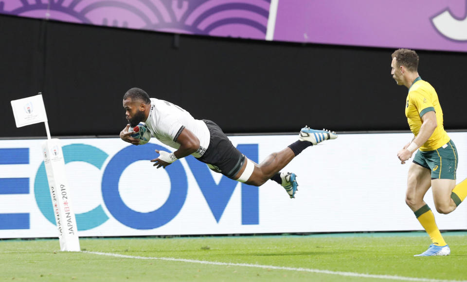 Fiji’s Peceli Yato is airborne to score a try against Australia during the Rugby World Cup Pool D game at Sapporo Dome between Australia and Fiji in Sapporo, northern Japan, Saturday, Sept. 21, 2019. (Masanori Takei/Kyodo News via AP)