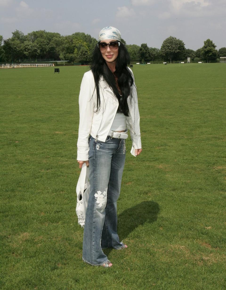 <p>In a bandana, white moto jacket and cross embroidered jeans for Dior's show during Paris Couture Week. </p>