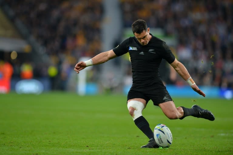 New Zealand's fly half Dan Carter converts the first try during the Rugby World Cup final against New Zealand at Twickenham stadium on October 31, 2015