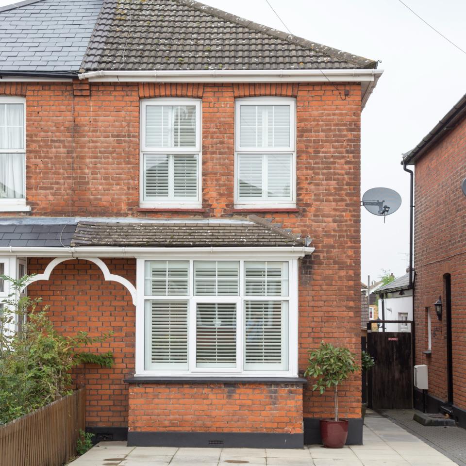 Brick house with white window frames