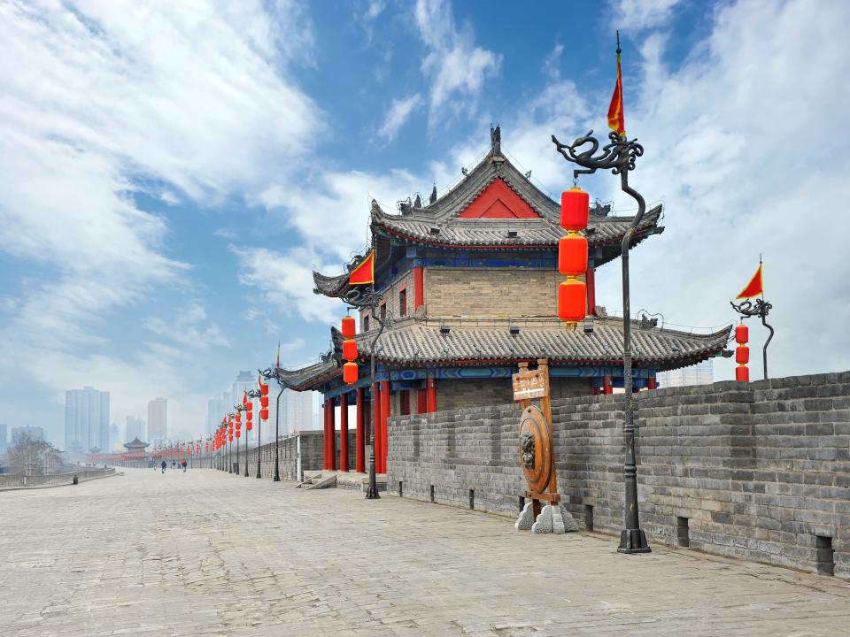 shot of the historic walls in xi'an china on a cloudy day with blue skies