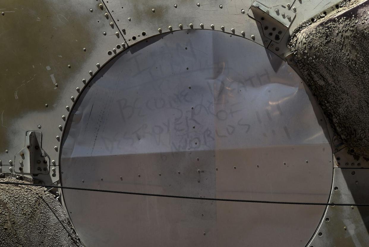 The words Robert Oppenheimer quoted from the Gita, seen written in dust on part of a deactivated nuclear missile at the Pima Air & Space Museum. <a href="https://www.gettyimages.com/detail/news-photo/the-words-of-robert-oppenheimer-an-inventor-of-the-atomic-news-photo/473277288?adppopup=true" rel="nofollow noopener" target="_blank" data-ylk="slk:Brendan Smialowski/AFP via Getty Images;elm:context_link;itc:0;sec:content-canvas" class="link ">Brendan Smialowski/AFP via Getty Images</a>