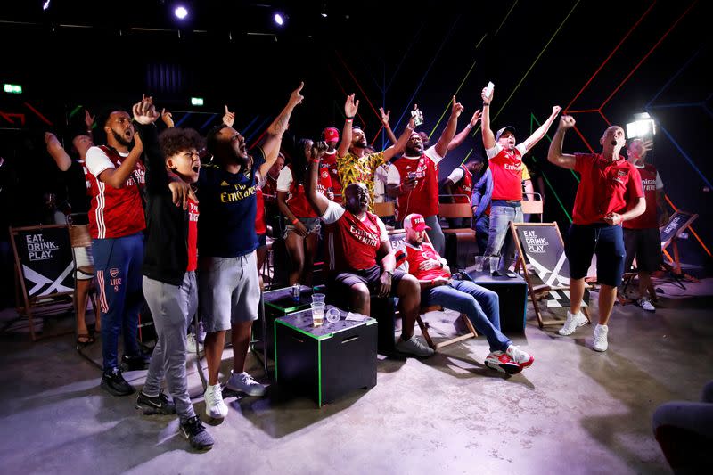 Arsenal fans watch the FA Cup Final between Arsenal and Chelsea