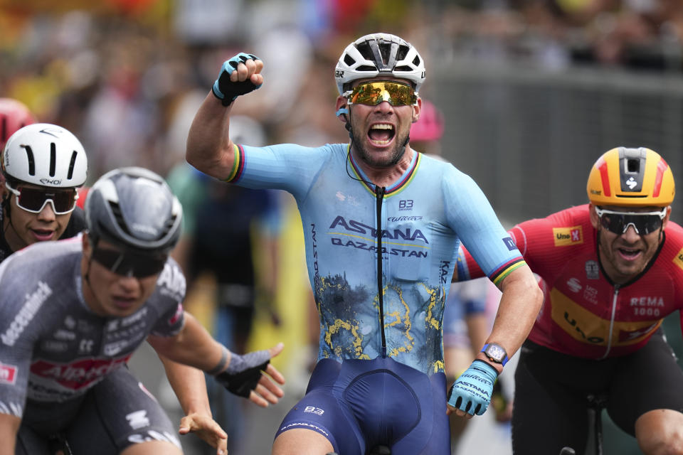 Britain's sprinter Mark Cavendish crosses the finish line to win a record 35th Tour de France stage win to break the record of Belgian legend Eddy Merckx in the fifth stage of the Tour de France cycling race over 177.4 kilometers (110.2 miles) with start in Saint-Jean-de-Maurienne and finish in Saint-Vulbas, France, Wednesday, July 3, 2024. (AP Photo/Daniel Cole)