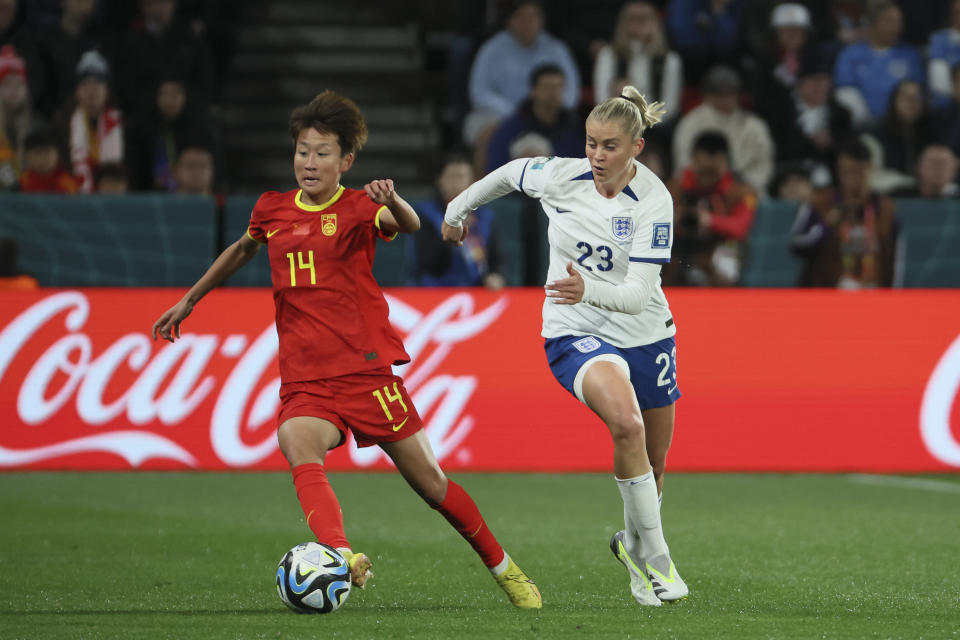 China's Lou Jiahui, left, battle for control of the ball with England's Alessia Russo during the Women's World Cup Group D soccer match between China and England in Adelaide, Australia, Tuesday, Aug. 1, 2023. (AP Photo/James Elsby)