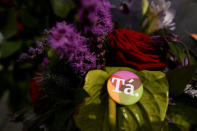 A badge with a message of 'Ta' in Irish language meaning 'Yes' in English is left with flowers at a memorial to Savita Halappanavar a day after an Abortion Referendum to liberalise abortion laws was passed by popular vote, in Dublin, Ireland May 27, 2018. REUTERS/Clodagh Kilcoyne