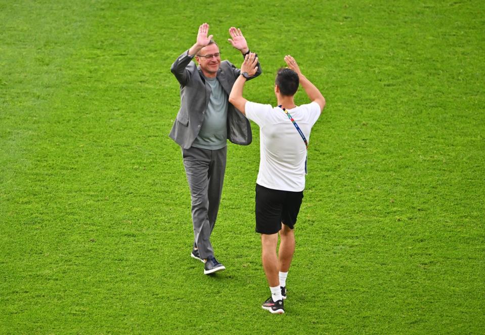 Rangnick, left, is congratulated after the win (Getty)