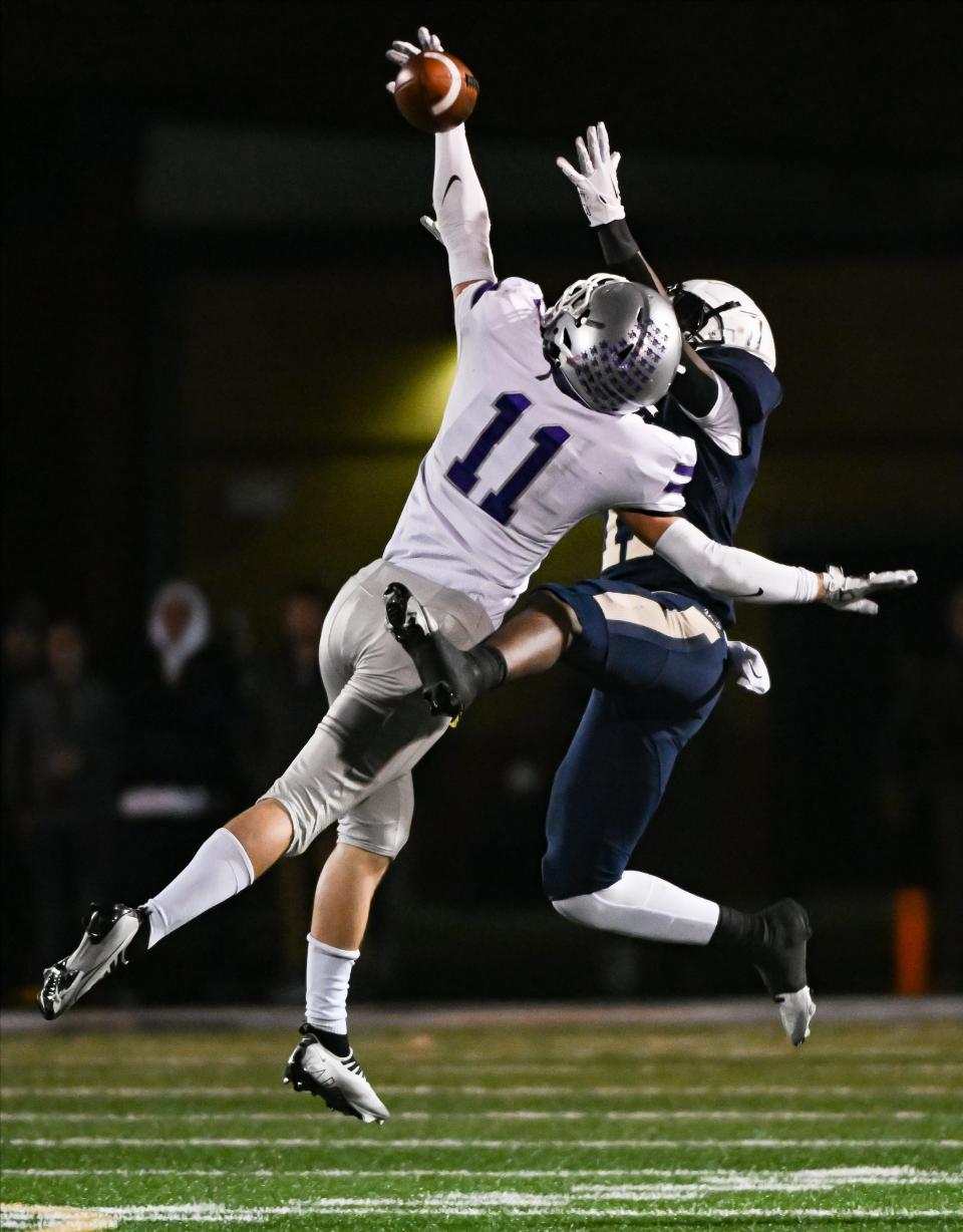 Bloomington South’s Miles McKay (11) breaks up a pass intended for Decatur Central’s N’Po Dodo during the IHSAA 5A semistate football game at Decatur Central on Friday, Nov. 17, 2023.