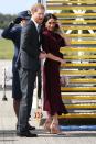 <p>Flying out of Sydney Airport Meghan Markle rewore her <a href="https://www.aquazzura.com/en/boutique-online/woman/view-all/pumps/pointy-toe/casablanca-pump-105-powder-pink-suede-leather.html" rel="nofollow noopener" target="_blank" data-ylk="slk:Aquazzura pumps;elm:context_link;itc:0;sec:content-canvas" class="link ">Aquazzura pumps</a> from the night before, with a <a href="https://www.cuyana.com/mini-chain-saddle-bag.html" rel="nofollow noopener" target="_blank" data-ylk="slk:Cuyana Mini Chain Saddle Bag;elm:context_link;itc:0;sec:content-canvas" class="link ">Cuyana Mini Chain Saddle Bag</a> and a <a href="https://www.hugoboss.com/uk/slim-fit-dress-in-soft-jersey-with-detachable-belt/4029049659730.html?gclid=CjwKCAjwmdDeBRA8EiwAXlarFkvy4fNgIW0KHOqep_etwdTAUvkw4z7IOyxiqkgag1-uXxTHOsF5XBoCsnkQAvD_BwE&ranMID=39079&ranEAID=QFGLnEolOWg&ranSiteID=QFGLnEolOWg-.Xk6Jiu31NQQGW4oG3VF6Q&siteID=QFGLnEolOWg-.Xk6Jiu31NQQGW4oG3VF6Q&awc=3767_1540812701_dac01f43ab7ac6f6e67c04fcc45245f3" rel="nofollow noopener" target="_blank" data-ylk="slk:Hugo Boss maroon dress;elm:context_link;itc:0;sec:content-canvas" class="link ">Hugo Boss maroon dress</a>.</p>