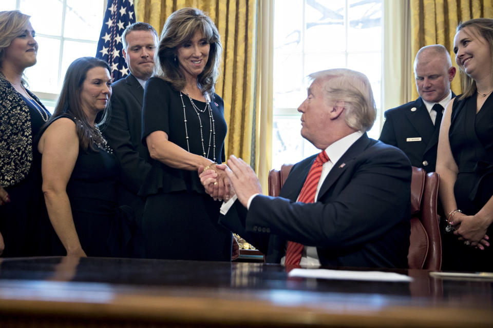 Southwest captain Tammie Jo Shults meet President Trump after safely landing Flight 1380 after an engine blew. (Photo: Andrew Harrer-Pool/Getty Images)