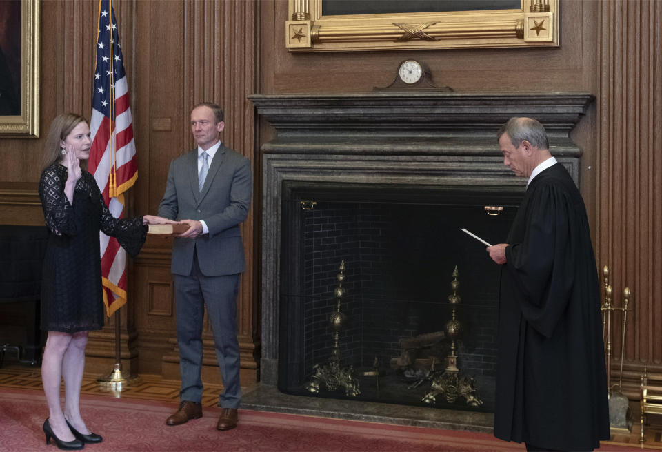 Chief Justice John Roberts (right) has twice joined more liberal justices to save the Affordable Care Act. But now he would need at least one more conservative to join him, putting the focus on newly confirmed Justice Amy Coney Barrett (right). (Photo: Getty Images)