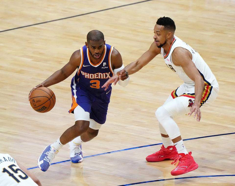 Suns' Chris Paul (3) dribbles against Pelicans' CJ McCollum (3) during Game 6 of the first round of the Western Conference Playoffs.