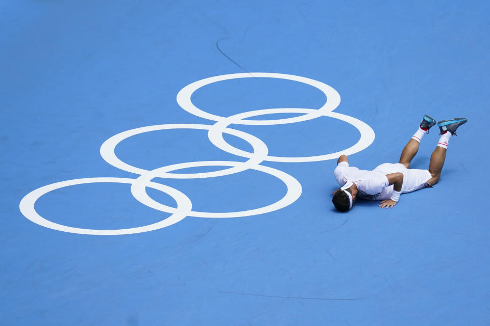 Fabio Fognini, of Italy, reacts after losing a point to Daniil Medvedev, of the Russian Olympic Committee, during the third round of the men's tennis competition at the 2020 Summer Olympics, Wednesday, July 28, 2021, in Tokyo, Japan. (AP Photo/Patrick Semansky)