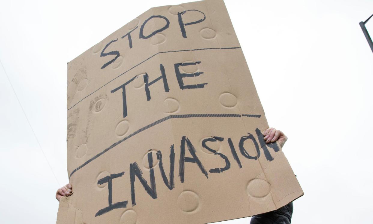 <span>A sign at an anti-immigration protest in Rotherham in February 2023. </span><span>Photograph: Gary Calton/The Observer</span>