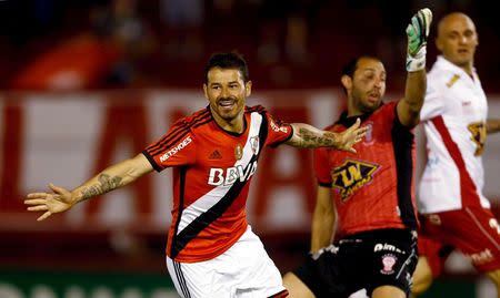 River Plate's Rodrigo Mora (L) celebrates after scoring his team's second goal against Huracan in their Copa Sudamericana semi-final soccer match Buenos Aires, Argentina, November 26, 2015. REUTERS/Marcos Brindicci