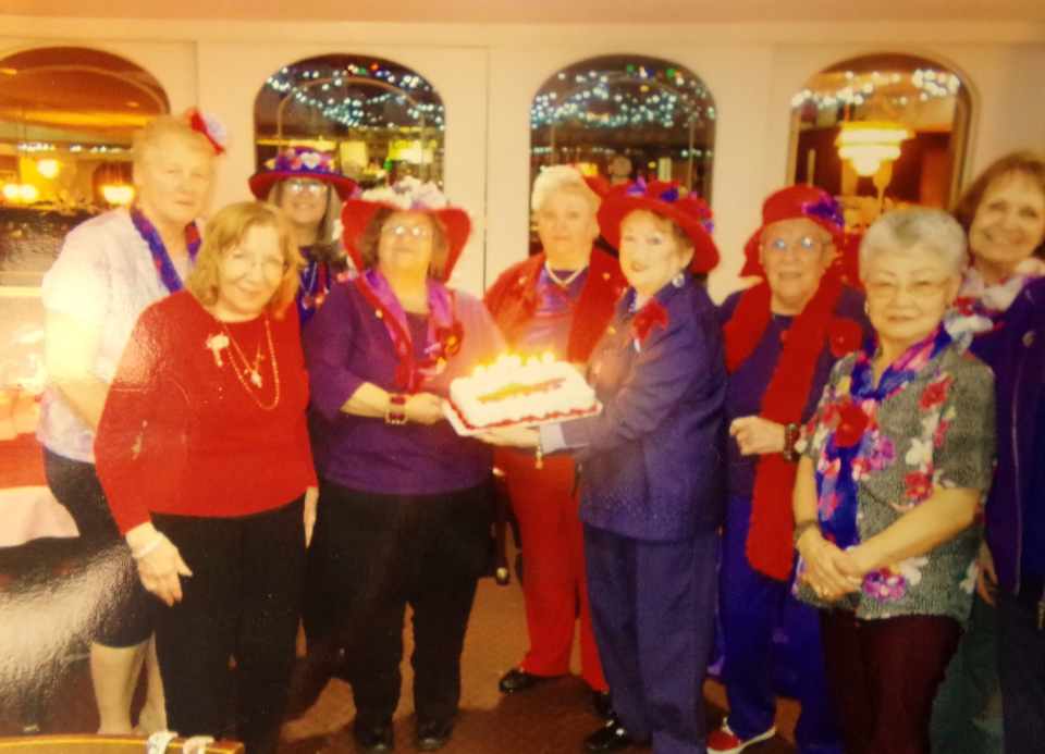 Celebrating "mutual birthdays," the Bette Boop Babes of the Hawley/Lakeville Red Hat Society Chapter celebrated at Cordaro's Restaurant in August 2023. From left are Linda Gramati, Barbara Ruggiero, Diane Stout, Ginnie Witherill, Arleen Kellu, Queen Mother Dee Cullen (holding cake), Vice Queen Judy Maneville, Lee DeKort, Arlene Battista and Treasurer Karen McGhee.