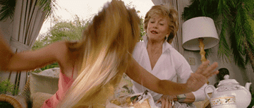 Jane Fonda smashes Jennifer Lopez's head into a cake during a scene from the movie Monster-In-Law.