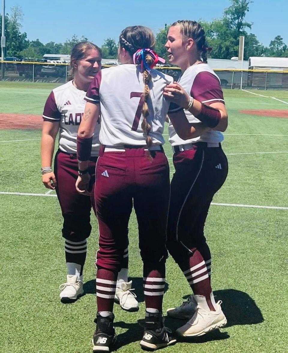 Converse's Summer Brumley, Rayni Rivers and Avery Prine celebrate Prine's walkoff two-run home-run in the LHSAA Non-Select Division V semifinal contest Friday in Sulphur.