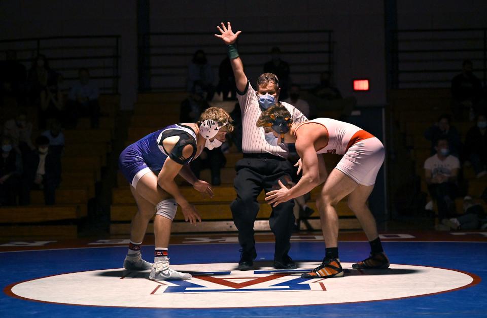 Ashland's Matt Gillis (left) and Wayland's Luciano Sebastianelli square off in their 182 lbs. bout at Ashland Middle School, Jan. 13, 2021.