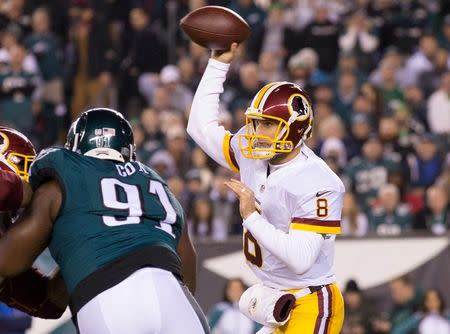 Dec 26, 2015; Philadelphia, PA, USA; Washington Redskins quarterback Kirk Cousins (8) passes against the Philadelphia Eagles during the first quarter at Lincoln Financial Field. Mandatory Credit: Bill Streicher-USA TODAY Sports