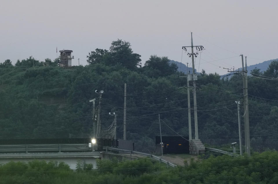 A North Korean military guard post, left top, is seen in Paju near the border with North Korea, South Korea, Tuesday, July 18, 2023. An American has crossed the heavily fortified border from South Korea into North Korea, the American-led U.N. Command overseeing the area said Tuesday, amid heightened tensions over North Korea's nuclear program. (AP Photo/Ahn Young-joon)
