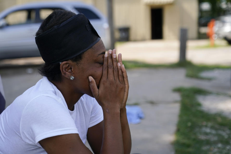 Mildred Joyner, who was in her mobile home when a deadly tornado destroyed it, sits outside her aunt's mobile home that sustained damage, in Rolling Fork, Miss., Friday, May 19, 2023. The tornado hit Joyner's mobile home so hard she felt it shake, heard the cracking sound of what she figured was her home coming apart and then she woke up in the hospital. (AP Photo/Gerald Herbert)