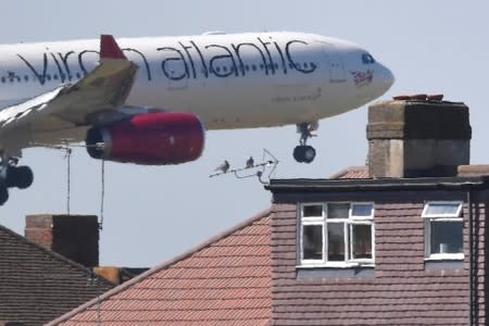 A Virgin Atlantic Airbus comes in to land at Heathrow aiport in London