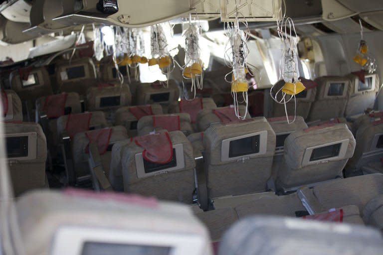 The inside of the crashed Asiana plane is shown July 7, 2013 in San Francisco, California. The flight crew of the Asiana Airlines Boeing 777 that crashed at San Francisco Airport couldn't see the runway just seconds before the accident, given how far the plane was out of position, US investigators said