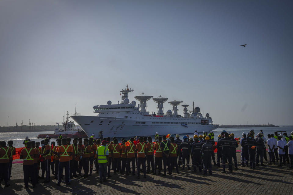 Sri Lankan ports workers wait to receive Chinese research ship Yuan Wang 5 as it arrives in Hambantota International Port in Hambantota, Sri Lanka, Tuesday, Aug. 16, 2022. The ship was originally set to arrive Aug. 11 but the port call was deferred due to apparent security concerns raised by India. (AP Photo/Eranga Jayawardena)