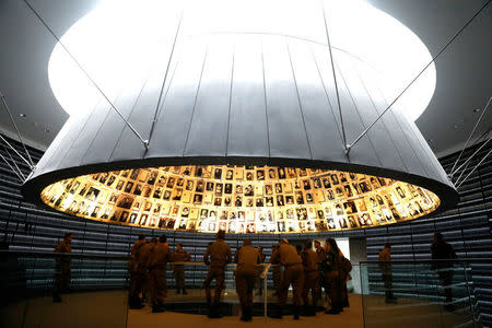 A group of Israeli soldiers visits the Hall of Names in the Holocaust History Museum at the Yad Vashem World Holocaust Remembrance Center in Jerusalem ahead of the Israeli annual Holocaust Remembrance Day, April 10, 2018. Picture taken April 10, 2018. REUTERS/Ronen Zvulun